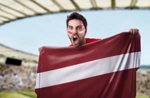 Fan holding the flag of Latvia